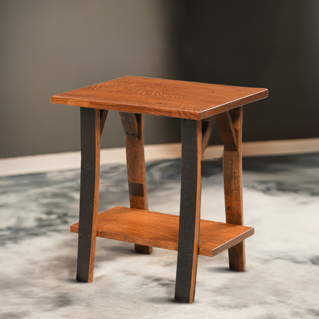 The Barrel Side Table, made from reclaimed wood with dark legs and a polished brown top, adds rustic elegance to any space and looks stunning on a patterned floor.