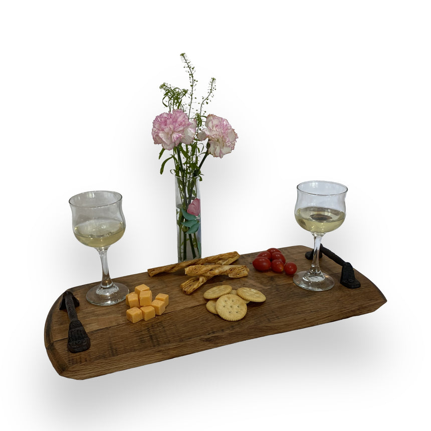 The Charcuterie and Cheese Rectangle Wooden Serving Board, full size and hand made from solid wood, is perfect for serving wine glasses, cheese, crackers, tomatoes, breadsticks, and adds rustic charm to your table.