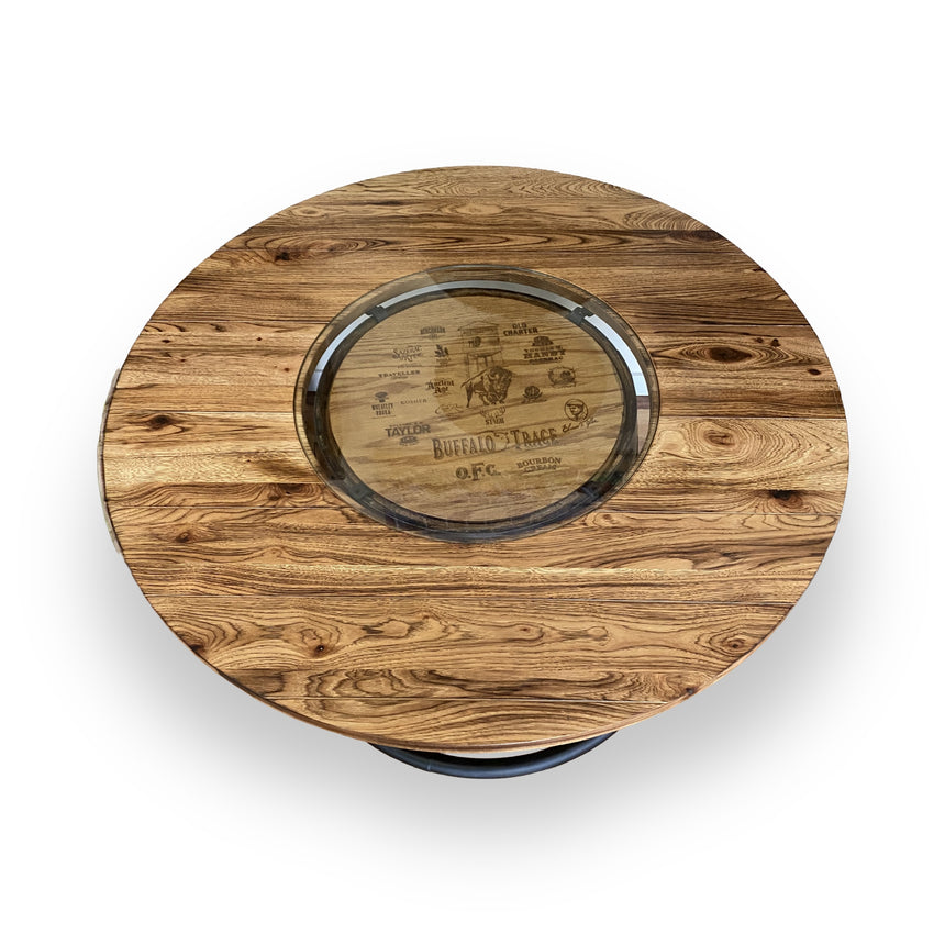 The Whiskey Barrel Pub Table features a 48-inch burnt hickory tabletop with a glass inset and hand made solid wood barrel construction, adding rustic charm to any space.
