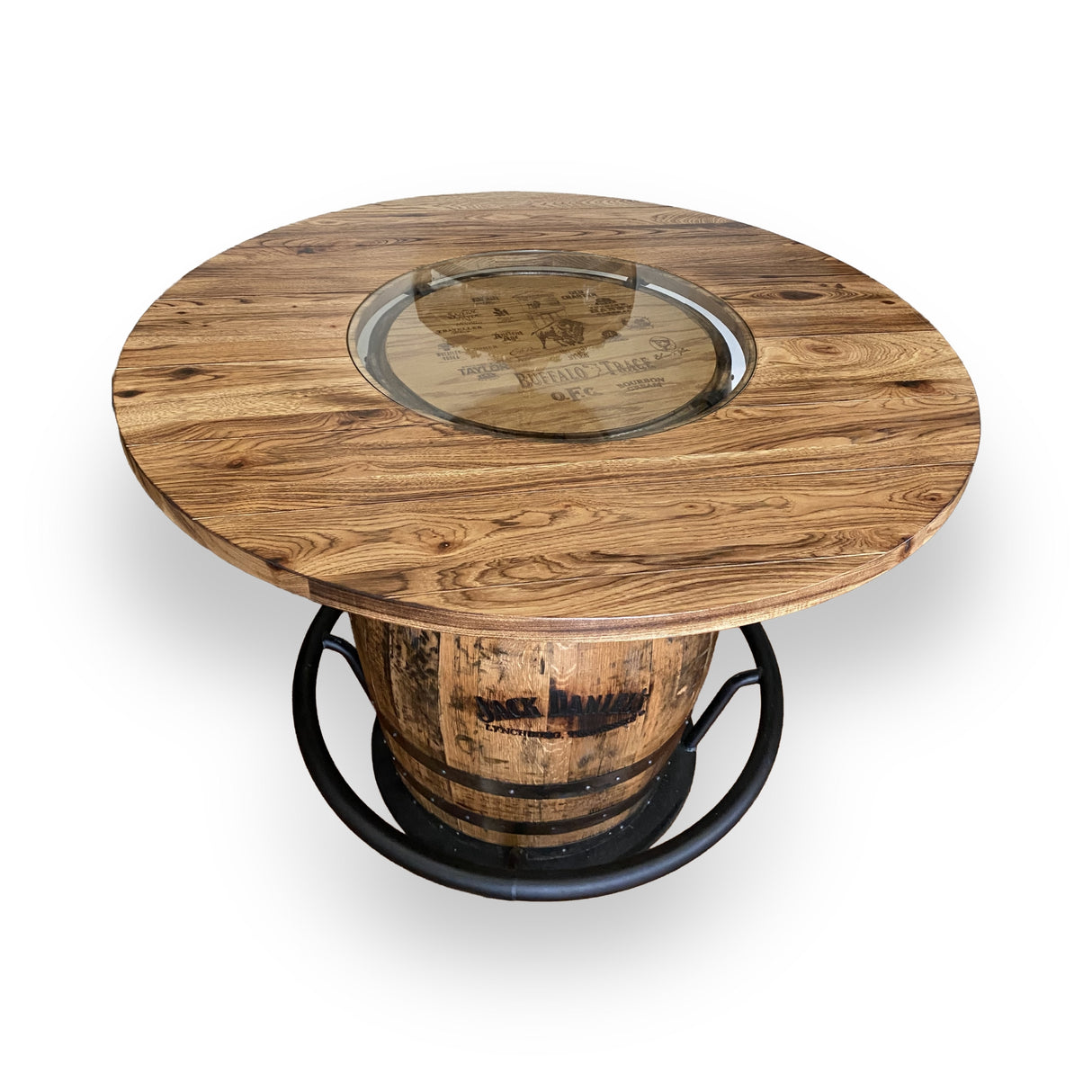 The Whiskey Barrel Pub Table features a 48-inch burnt hickory tabletop with a glass inset and handmade solid wood barrel construction, offering rustic charm and durability.