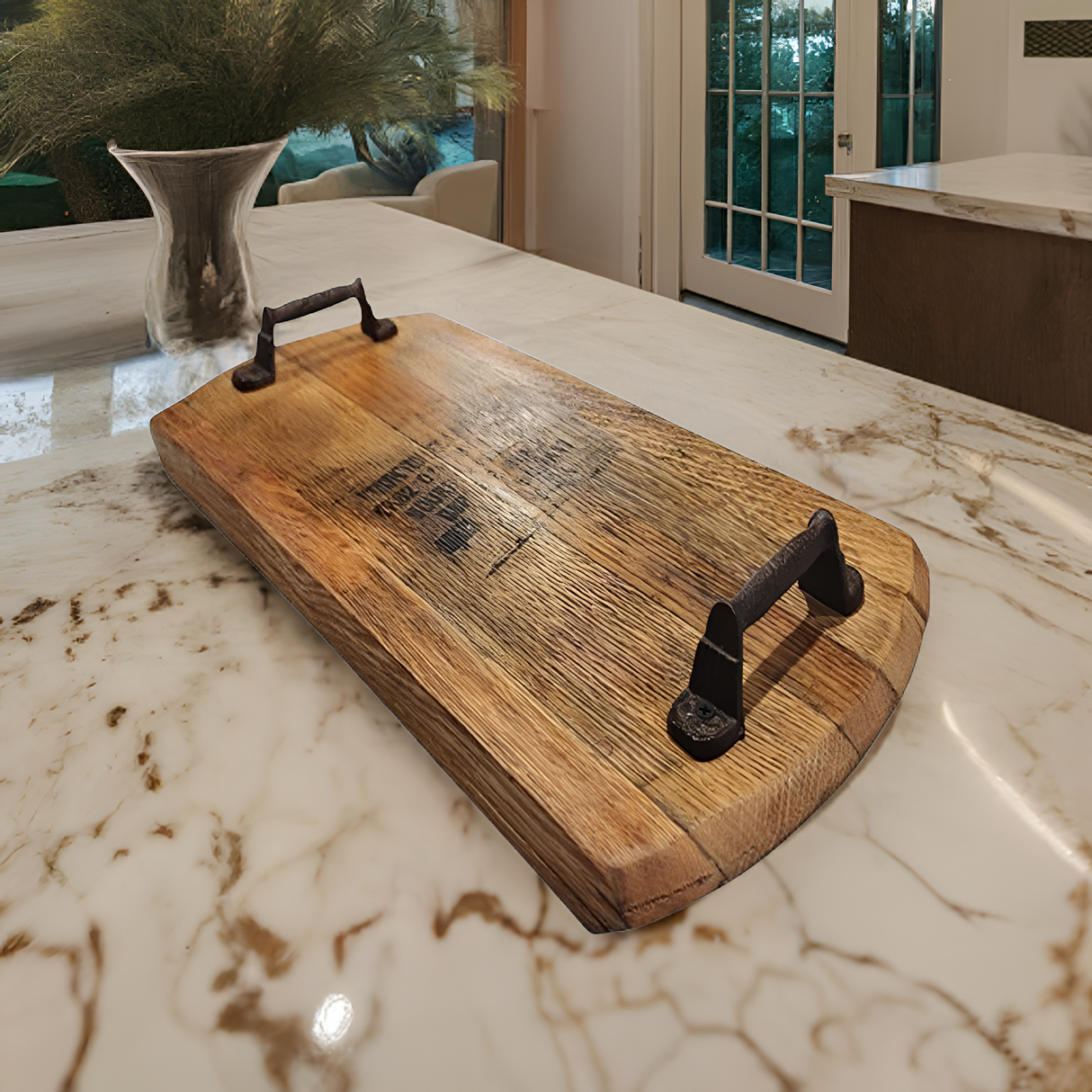 The Charcuterie and Cheese Rectangle Wooden Serving Board, full size and hand made from solid wood, brings rustic charm to a marble kitchen countertop.