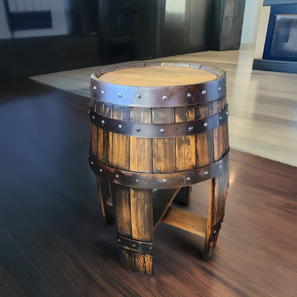 A hand-made solid wood end table with stave legs, designed in the style of a whiskey barrel, placed on a polished wooden floor indoors.