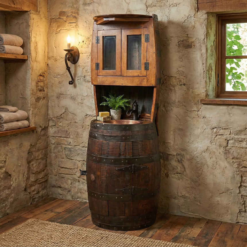 A Barrel Vanity serves as a rustic bathroom sink, placed against a stone wall with nearby shelves and towels.