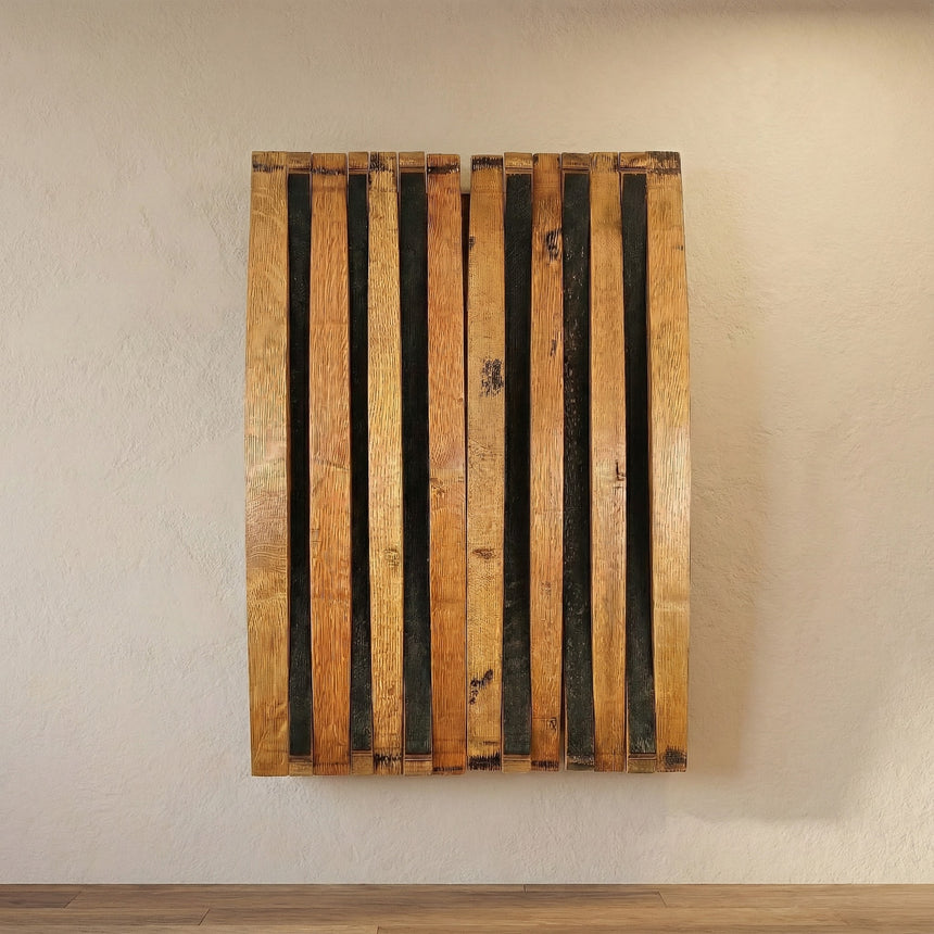 The hand made solid wood Barrel Stave Dart Board Cabinet fits a standard tournament dart board and is mounted on a light-colored textured wall above a wooden floor, adding unique style to any game room or DIY inspiration.