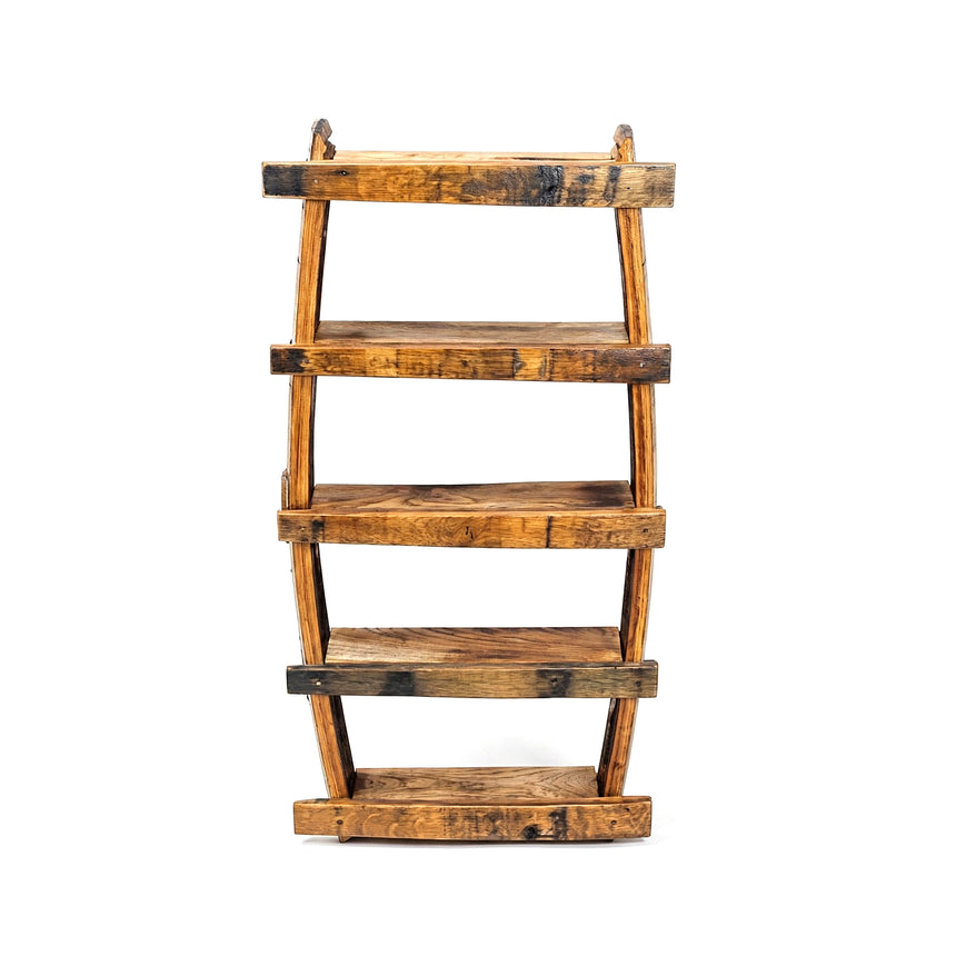 The Small Spice Rack is a wooden bookshelf with five uneven, rustic shelves, resembling a spice rack, shown from the front against a white background.