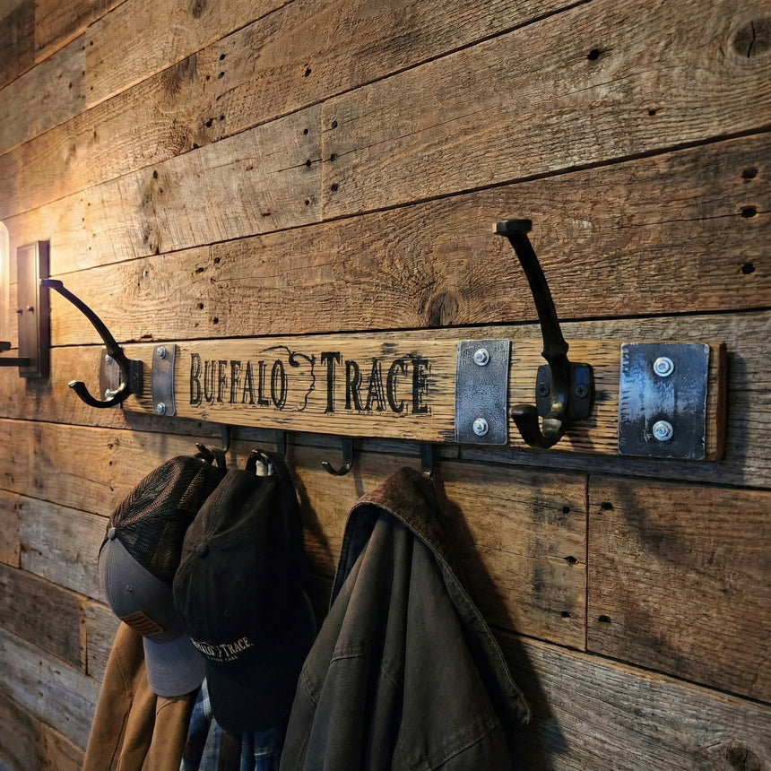 The Coat & Key Wooden Wall Mounted Rack features a Buffalo Trace inspired design with 2 double coat hooks and 4 key hooks—perfect for whiskey lovers seeking rustic style and organized storage.