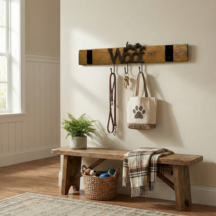 A bench with a plaid blanket, basket of dog toys, and a Leash Holder that organizes your leash, keys, and dog tote bag.
