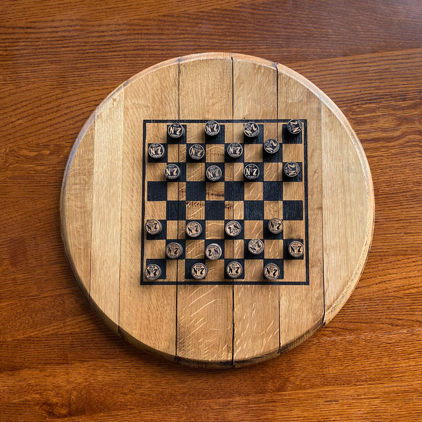 Handcrafted Chess and Checkers Board with a solid wood barrel head base and handmade playing pieces for versatile gameplay.