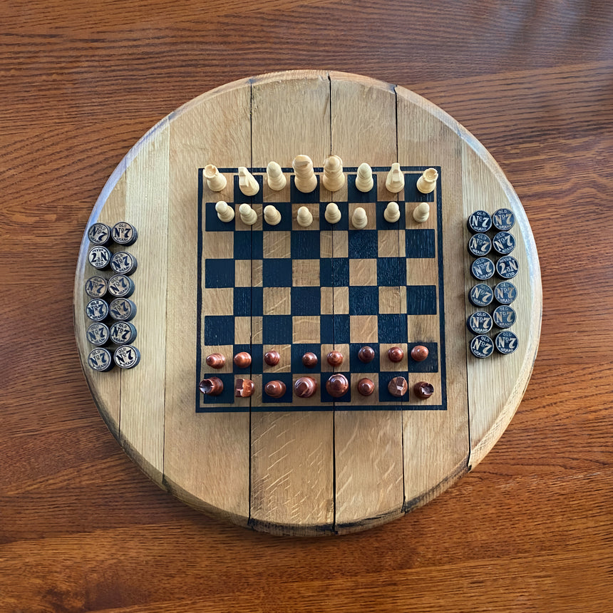 The Chess and Checkers Board With Solid Wood Barrel Head Base includes hand made chess pieces and twelve checkers pieces per side, all crafted from authentic oak barrels for a versatile and unique gaming experience.