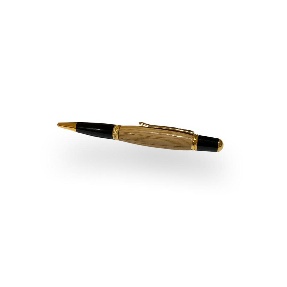 The Barrel Pen is a handcrafted executive pen with a gold and black finish, featuring a genuine oak whiskey barrel body, displayed on a white background.