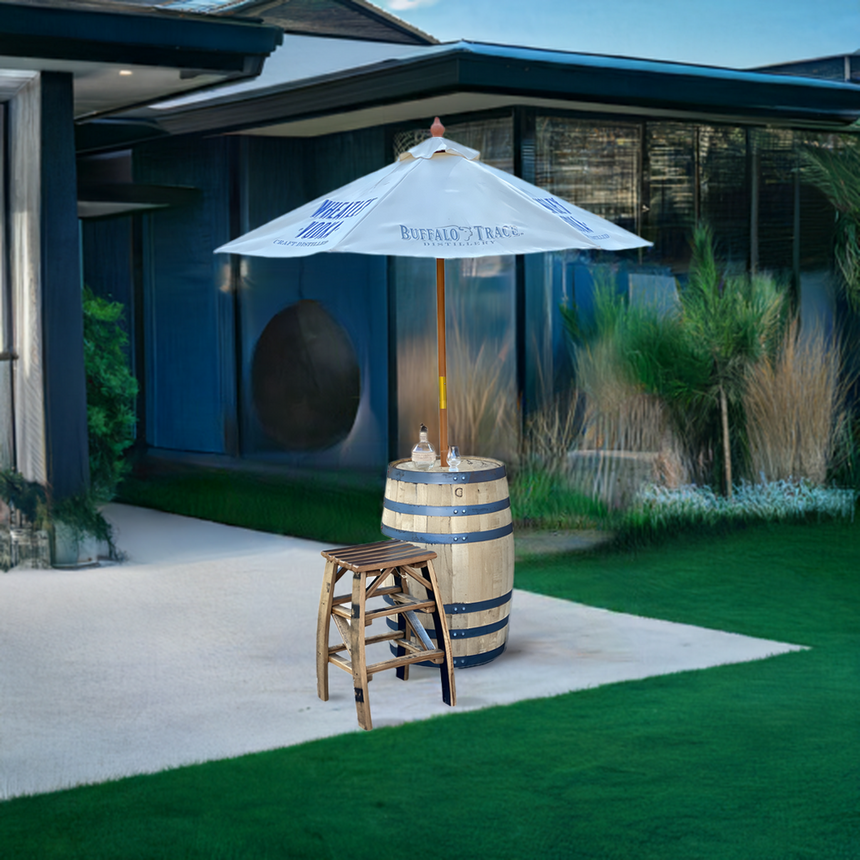 The Patio Pub Table, paired with drinks, a stool, and a white umbrella, creates an ideal outdoor entertaining setup for a modern patio or yard.