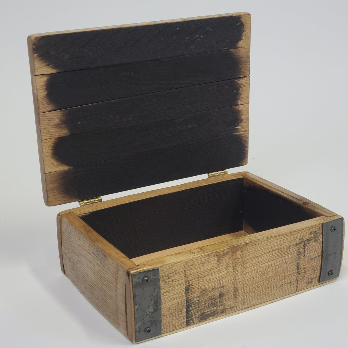The Small Stave Box - A009 is a compact organizer featuring an open, rustic wooden design with metal reinforcements on the corners and black paint on the inner and top panels, adding a touch of premium quality to any space.