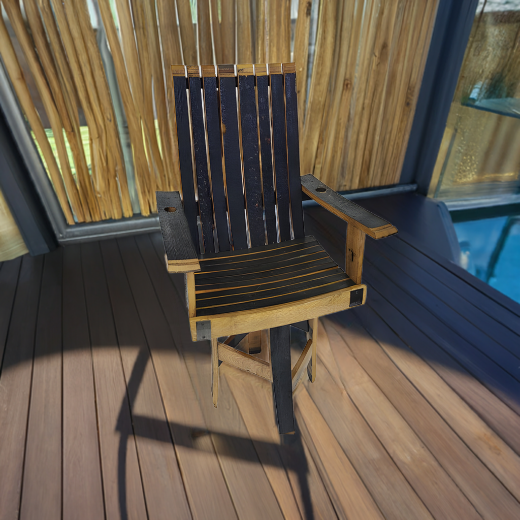 A hand made Swivel Lounge Chair With Armrest, crafted from solid wood barrel staves, sits on a sunlit wooden deck near bamboo paneling.