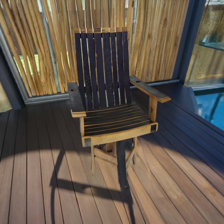 A hand made Swivel Lounge Chair With Armrest, crafted from solid wood barrel staves, sits on a sunlit wooden deck near bamboo paneling.