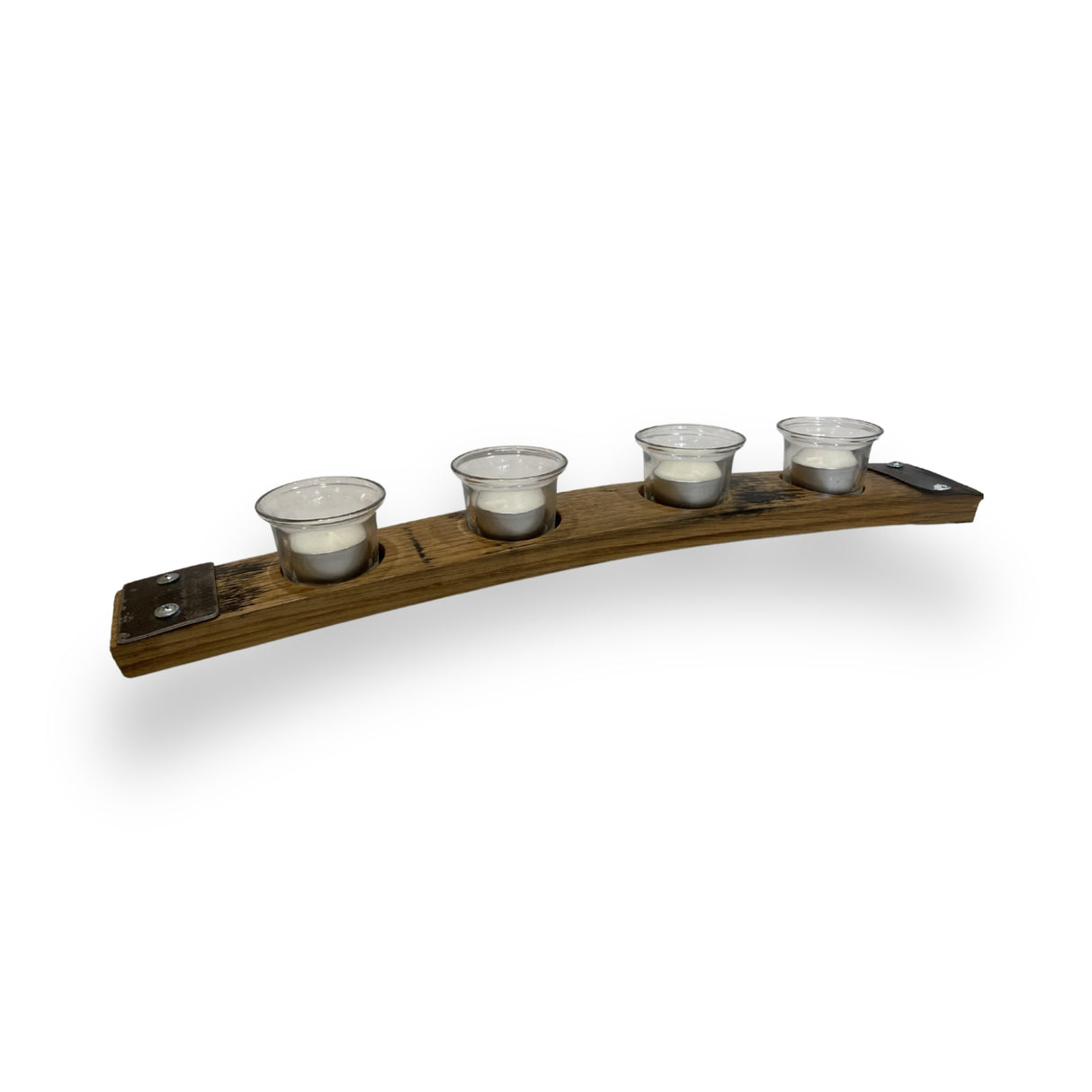 The Whiskey Barrel Stave Candle Holder features four glass votive cups arranged in a row on a curved wood base, adding rustic elegance to any space.