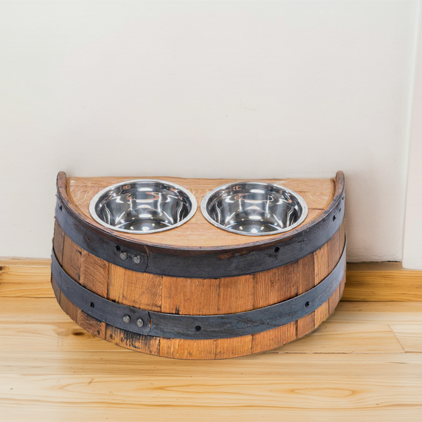 The Whiskey Barrel Pet Feeder features two metal pet bowls set in a stylish wooden barrel-style holder, perfect for adding charm to your space.
