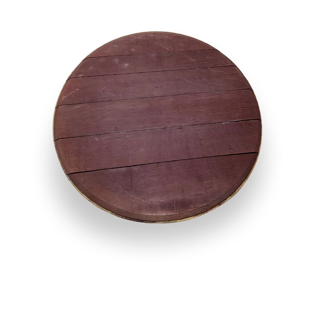 The Wine Barrel Head Charcuterie is a round wooden board with visible planks and a reddish-brown finish, evoking artisan craftsmanship inspired by classic wine barrels, shown from a top-down view.