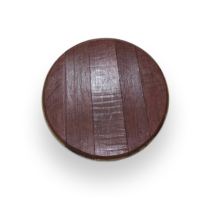 The Wine Barrel Head Charcuterie, a round wooden tabletop with a rich reddish-brown finish, is shown from above against a white background. Artisan craftsmanship is evident in every detail of this elegant piece.