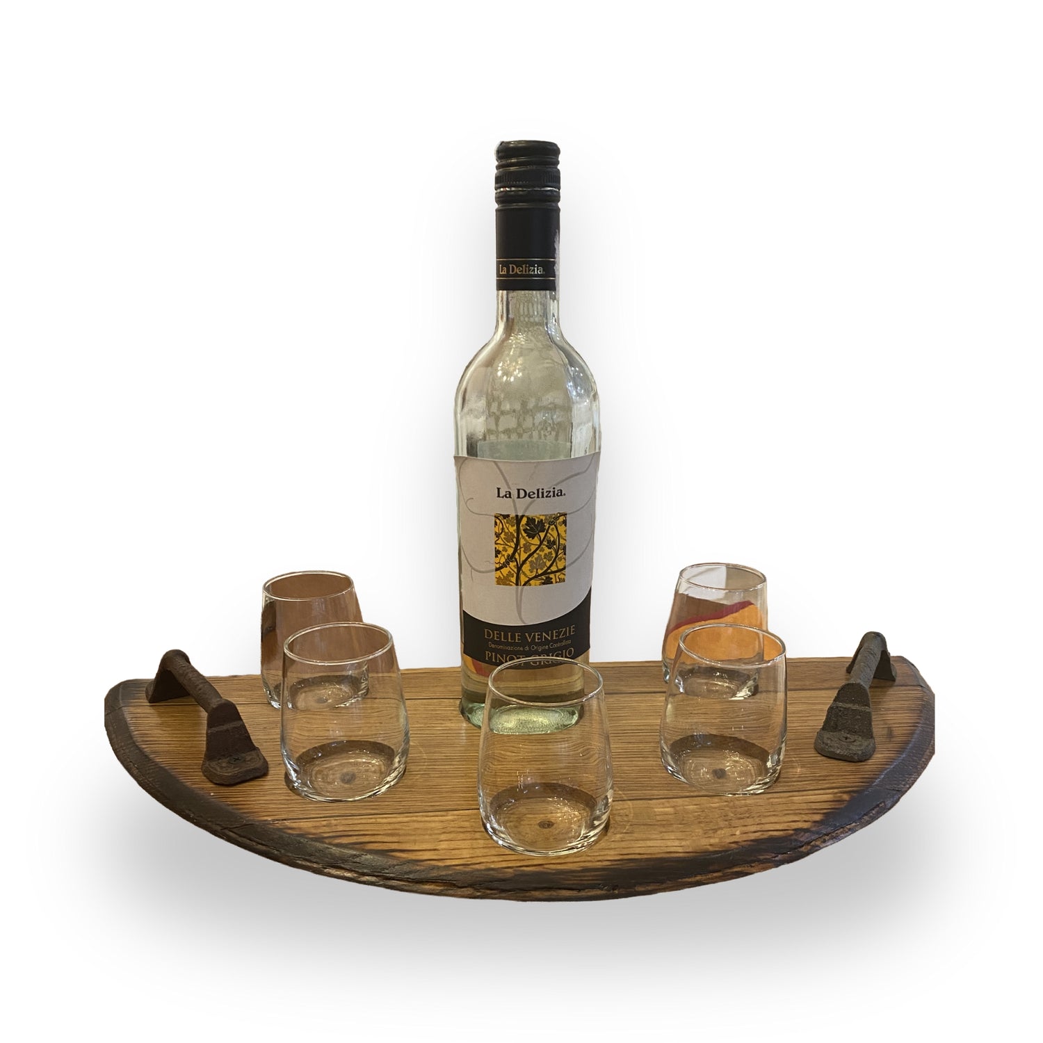 The Wine Tasting Tray showcases a wine bottle and four glasses on a handcrafted barrel-head tray, each paired with a small utensil for a touch of rustic elegance.