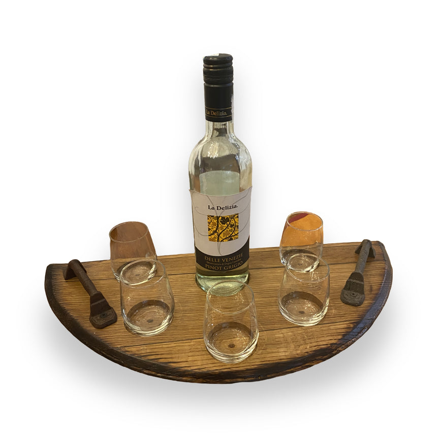 The Wine Tasting Tray, made from handcrafted barrel heads, holds a wine bottle, four glasses, and two metal corkscrews on each side, bringing rustic elegance to your gatherings.