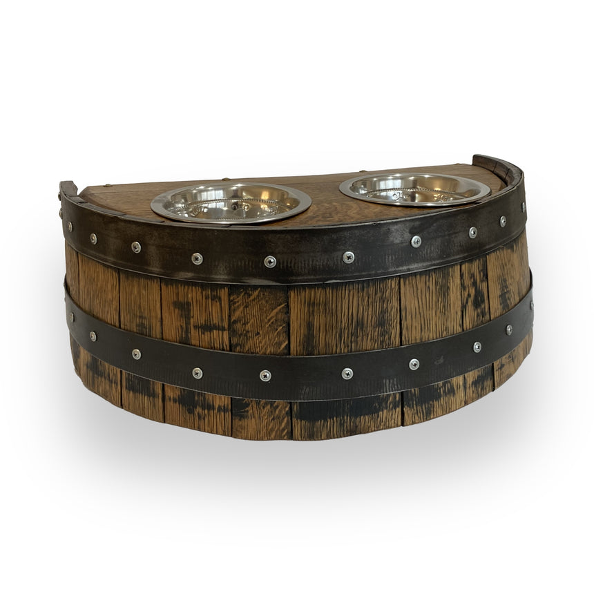 The Whiskey Barrel Pet Feeder is a sturdy, wooden, barrel-style elevated feeder with two metal bowls and decorative studs—adding charm and style to your space.