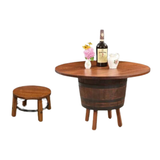 The Barrel Table with Legs exudes rustic charm with its wooden surface, displaying a vase and bottle. Complemented by a small round stool, it evokes whiskey barrel allure against a pristine white background.