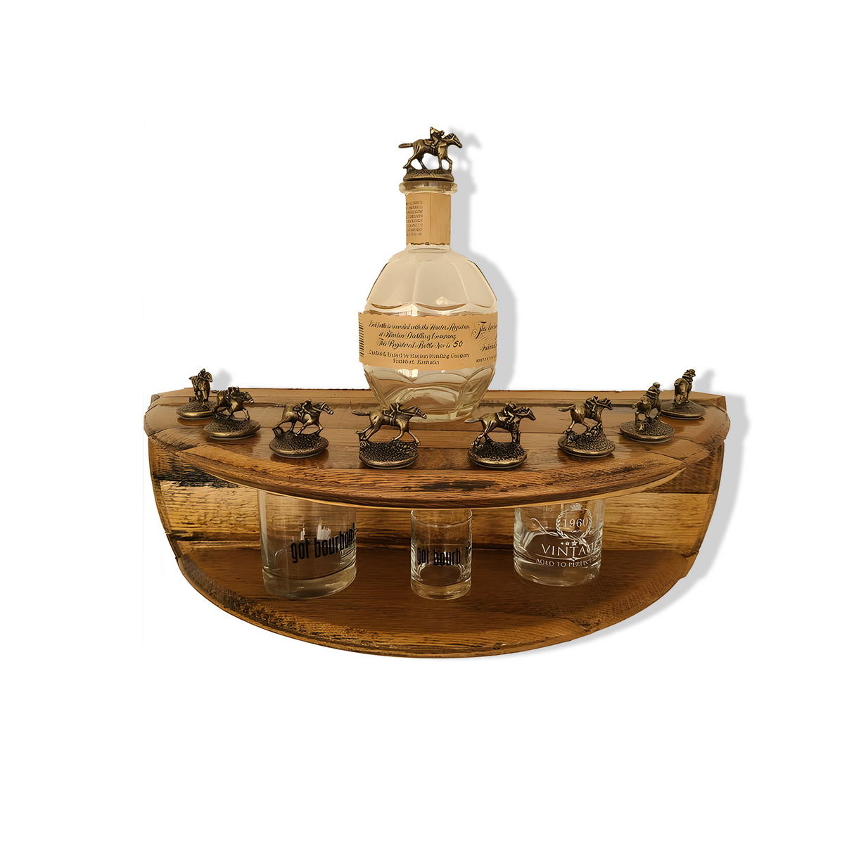 This 2-tier hand-made shelf, crafted from solid wood barrel construction, beautifully displays a Blanton's Bottle with horse cork stoppers and matching glasses. A must-have for any bourbon enthusiast.