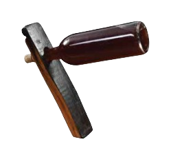 The Bottle Balancer is crafted from bourbon barrel staves, resembling a hammer, and rests a dark brown bottle on a black wooden plank.