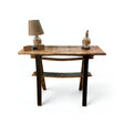 Handmade solid wood Console Wooden Table, crafted from barrel staves, ideal for foyer or entryway; shown topped with a lamp, two books, and a decorative bottle against a white background.
