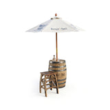 The Patio Pub Table, paired with a bottle, glass, barstool, and Buffalo Trace umbrella, creates the ideal outdoor bar table setup.