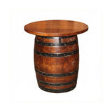 The Small Barrel End Table features a round wooden top and an upright barrel base with black metal bands, making it a stylish choice for bourbon furniture lovers.