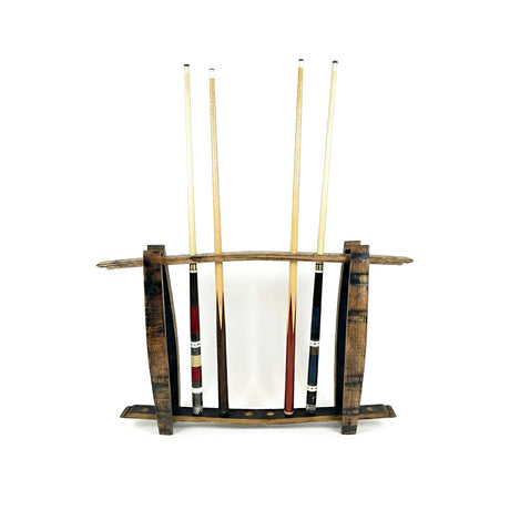 Four pool cues stand upright in a freestanding, hand made solid wood barrel stave cue rack that holds up to 8 billiard sticks, set against a white background.