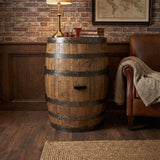 A Full Barrel Cabinet with Shelves and Glassware Holders, hand made from wood, serves as a charming full bar in a cozy rustic room, conveniently storing bottles and glasses for easy entertaining.