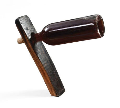 The Bottle Balancer is a unique wine holder crafted from bourbon barrel staves, designed to hold a wine bottle sideways by cradling its neck—a stylish and functional addition to any home.