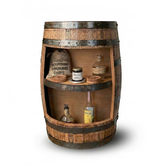 Handmade Half Barrel Open Cabinet with Shelves serves as a mini bar, displaying bottles, jars, and bourbon smoking chips—perfect as a rustic liquor shelf. Solid wood barrel construction against a white background.