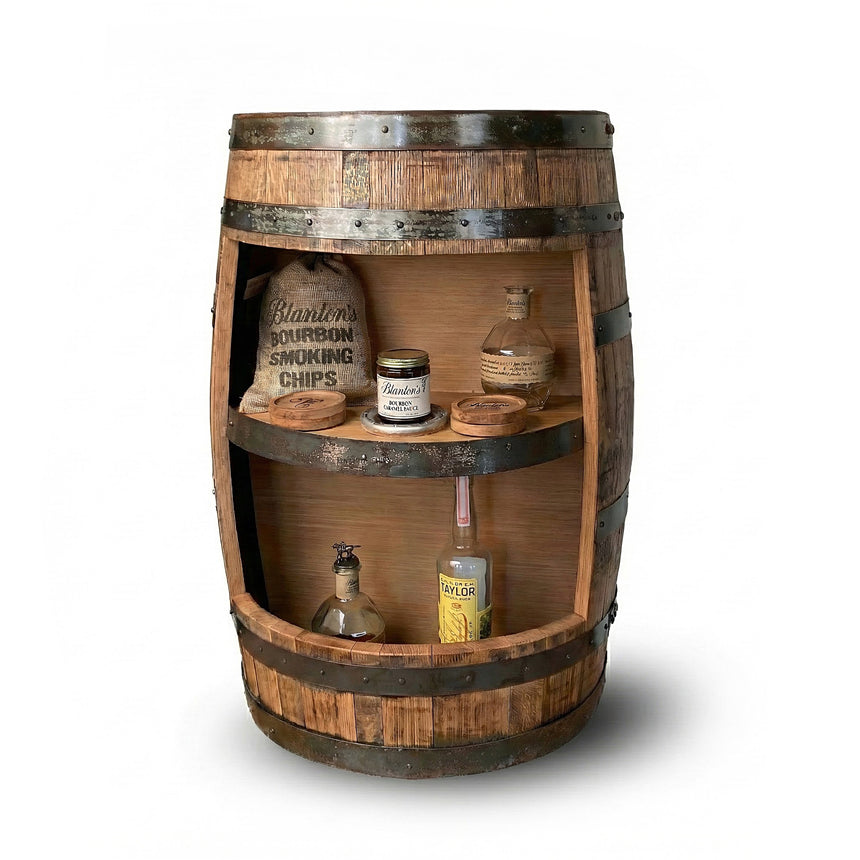 Handmade Half Barrel Open Cabinet with Shelves serves as a mini bar, displaying bottles, jars, and bourbon smoking chips—perfect as a rustic liquor shelf. Solid wood barrel construction against a white background.