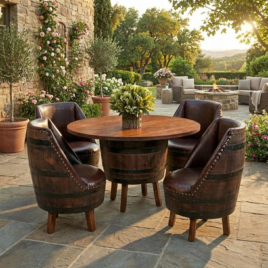 The Barrel Table with Legs and Upholster Barrel Stool Sofa on a stone patio, surrounded by plants and outdoor seating, creates a cozy setting inspired by classic whiskey barrel furniture.