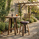 Cushioned Barstool With Backrest, hand made from solid wood barrel staves, sits beside a rustic table on a stone patio with a drink and potted plant, creating unique character in your garden space.