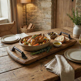 A roasted chicken with vegetables, bread, olives, olive oil, and a cheese board are served on the Charcuterie and Cheese Rectangle Wooden Serving Board, Full Size, made from hand made solid wood.