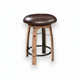 Bar Stool Cushioned Seat Without Back B-Black features a round wooden design, cushioned dark brown leather seat, metal footrest, and whiskey barrel-inspired details on a white background.