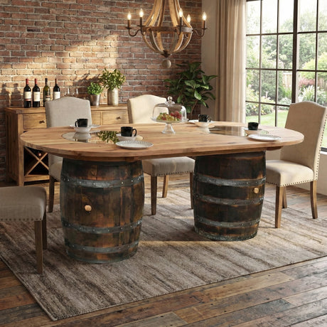 The Double Barrel Table features barrels as legs in a rustic setting with brick walls, a large window, and elegant chairs—a handcrafted piece ideal for anyone seeking unique barrel furniture.