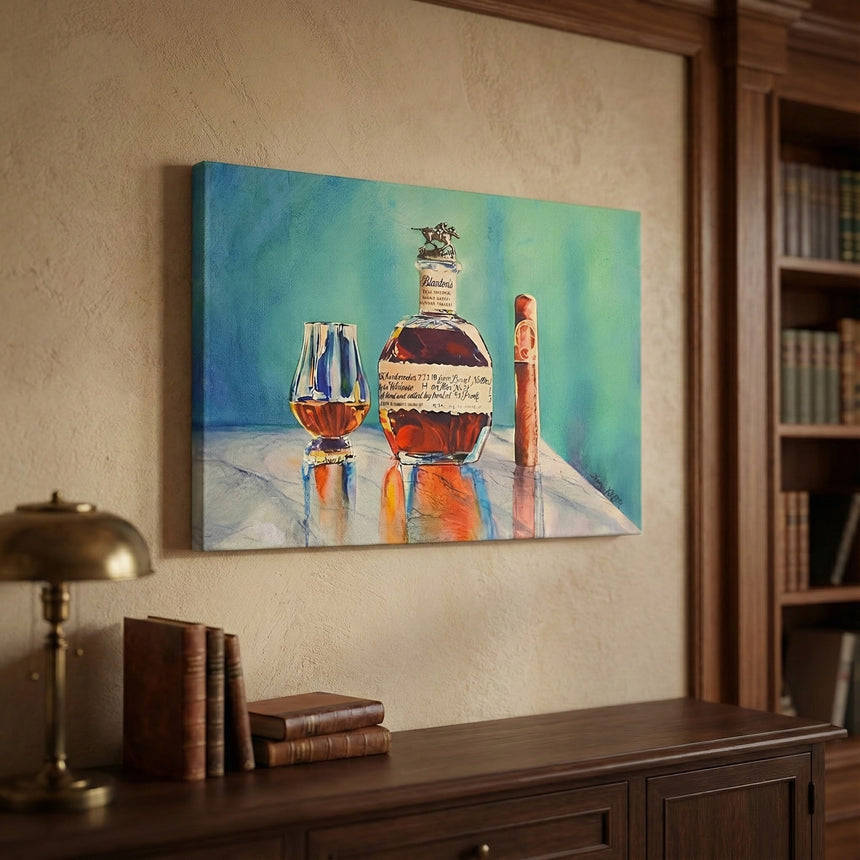 The Canvas Wall Art of Your Favorite Bourbon features whiskey, a glass, and a cigar above a wooden desk with books and a brass lamp, adding inviting rustic charm to your home decor.