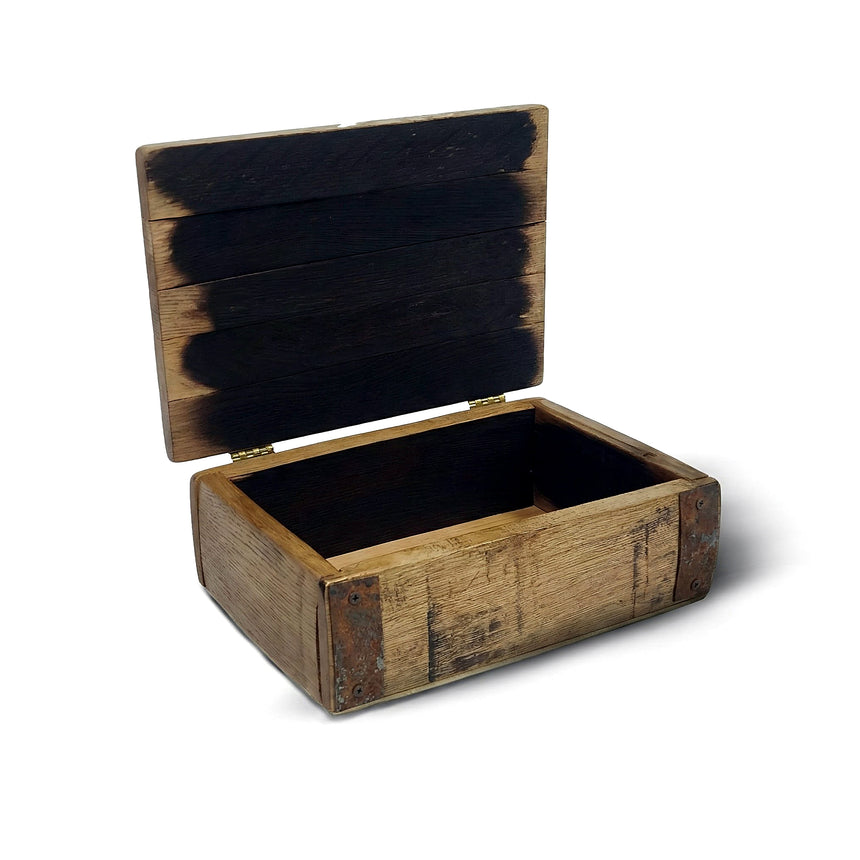 The Small Stave Box is an open, empty wooden whiskey barrel box featuring a rustic, weathered finish and dark interior stains.
