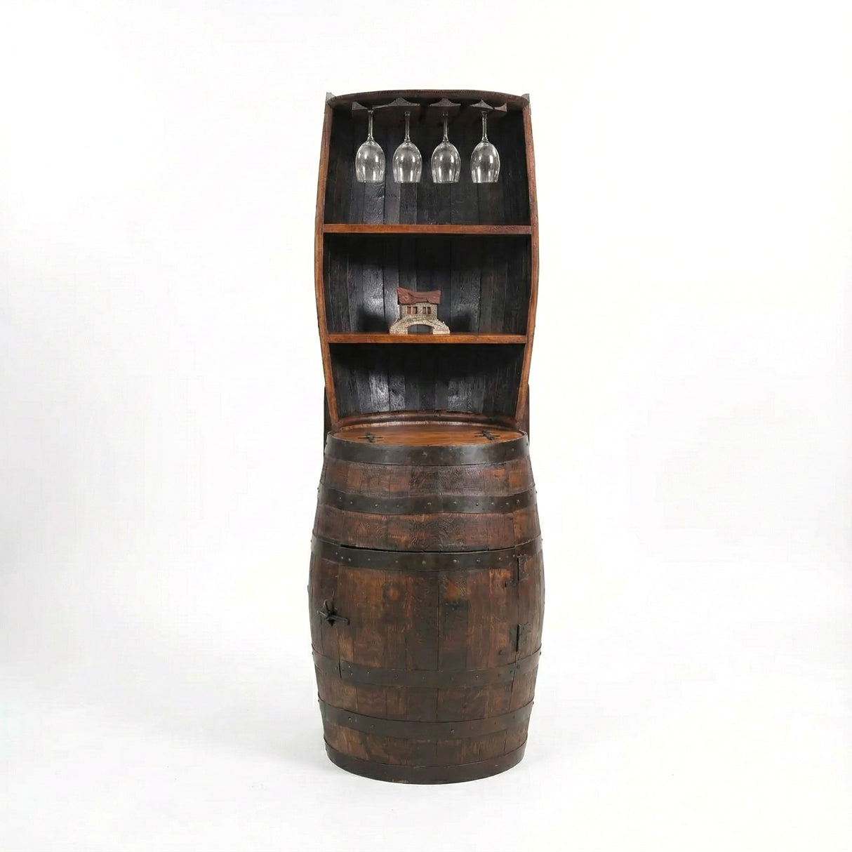 The Barrel Hutch is a handcrafted wooden barrel repurposed as a bar cabinet with shelves, wine glass holders, and space for decorative items.