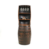 The Barrel Hutch, repurposed as a shelf for wine glasses and decor, brings rustic charm to any space.