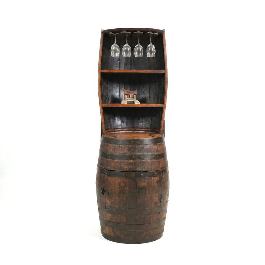 The Barrel Hutch, repurposed as a shelf for wine glasses and decor, brings rustic charm to any space.