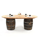 The Double Barrel Table features two handcrafted barrel bases and comes displayed with cups, plates, and a cake stand on a white background.