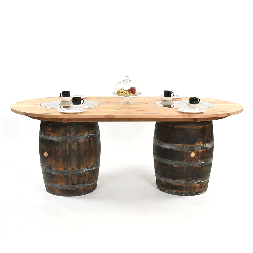The Double Barrel Table features two handcrafted barrel bases and comes displayed with cups, plates, and a cake stand on a white background.