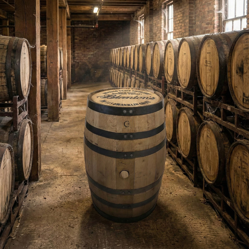 A Clean Full Barrel With Logo Head stands upright in a room lined with rows of aging barrels stacked on racks.