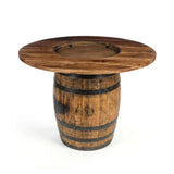 The Plain Barrel Table features a large round wooden barrel base and a wide circular tabletop, making it a striking handcrafted bar table decor piece.